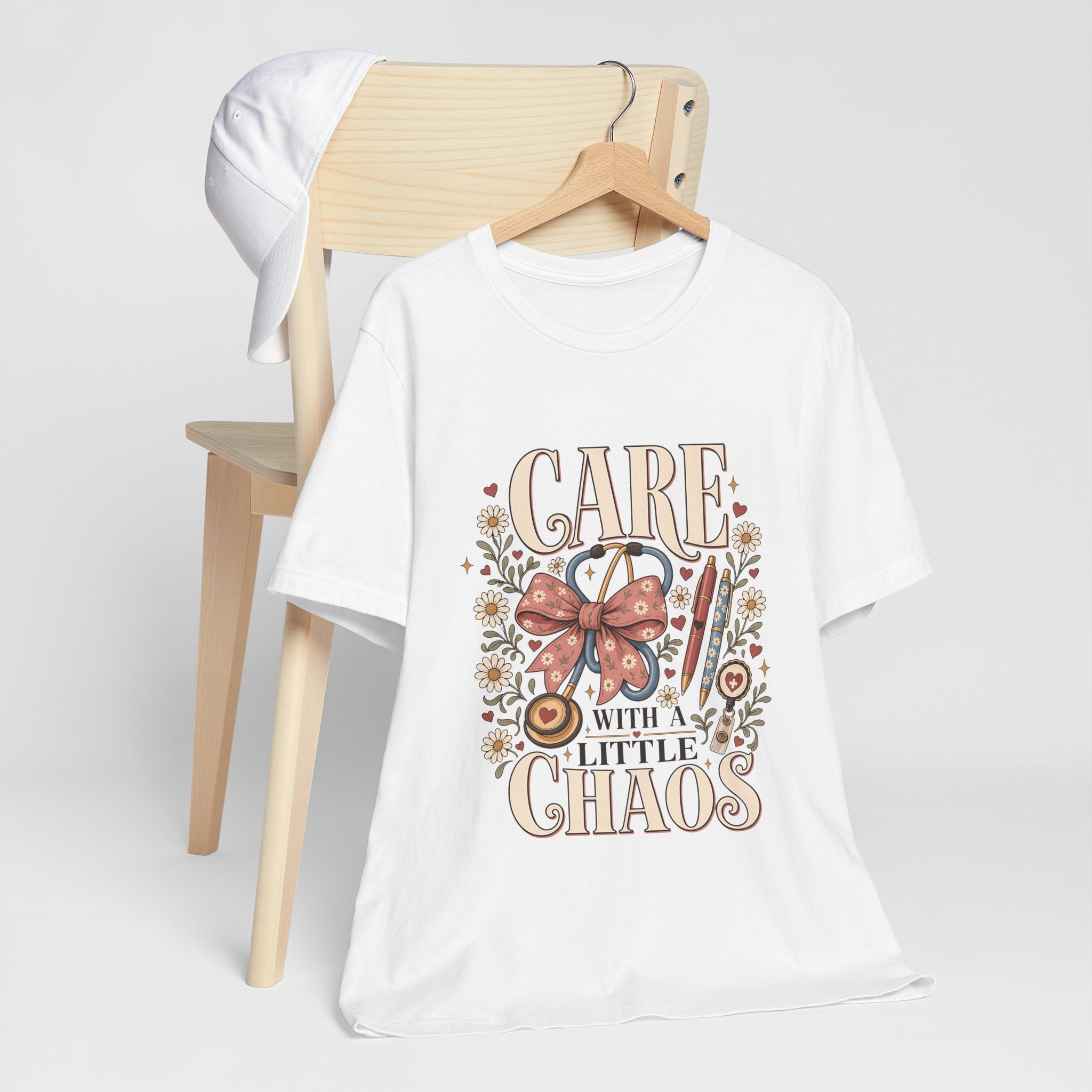 "Care With A Little Chaos" Coquette Nurse T-Shirt — Cute Nurse Graphic Tee